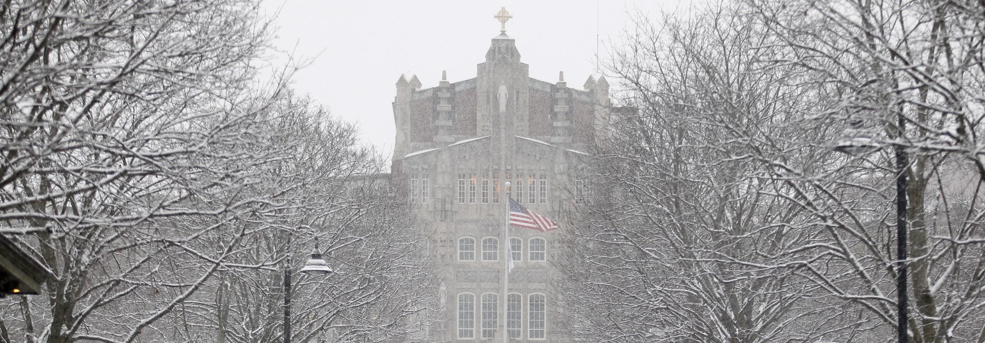 Harkins Building with American Flag and Snow Covered Trees,