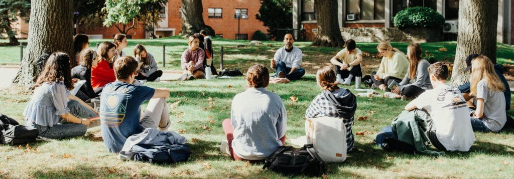 Outside Class Sitting in Grass in Circle